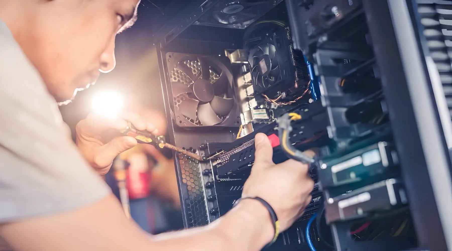 Technician repairing computer hardware