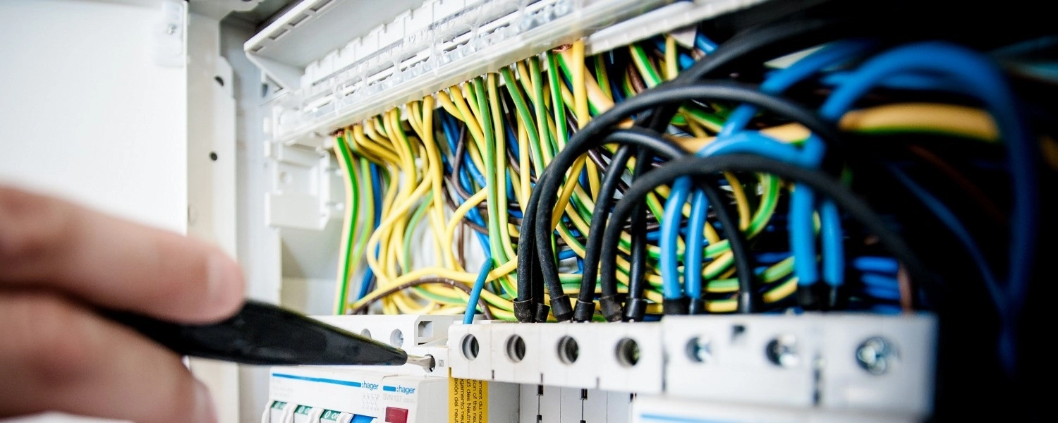 Electrician working on wiring panel